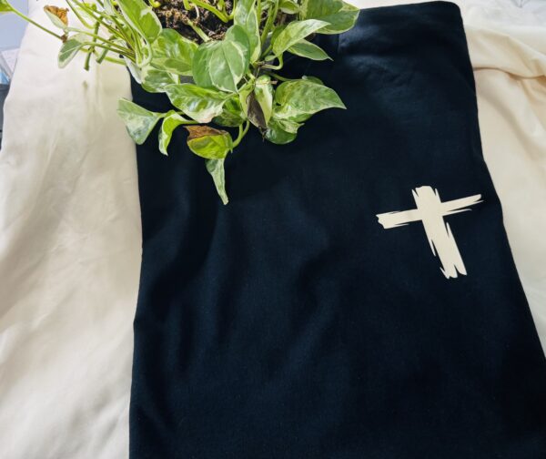 Cross on a black shirt.