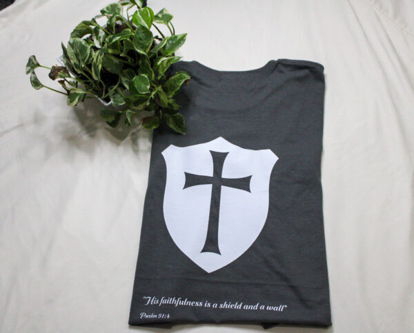 Shield on shirt.